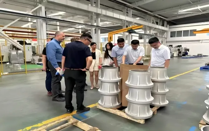 Customer and engineering personnel reviewing a furnace-parts project